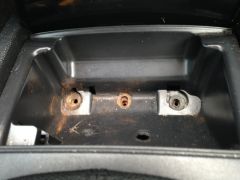Ashtray screw holes in console