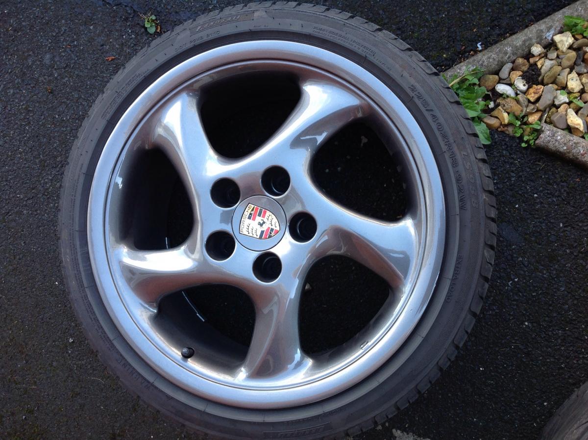 Genuine porsche turbo twists, 18inch, with adapters , v good tyres.. Mazda gunmetal grey.