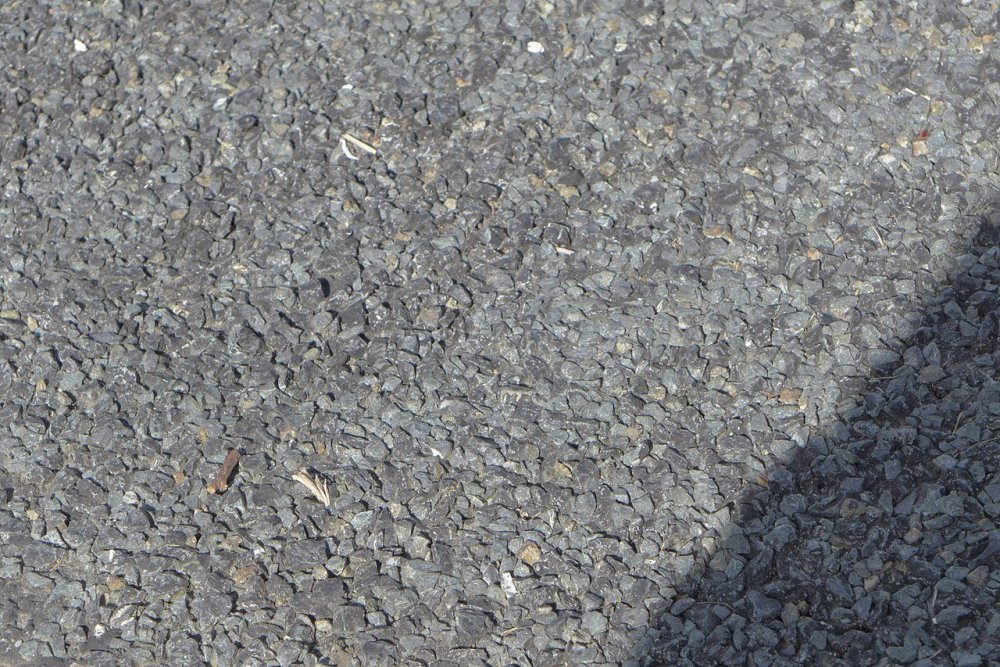 1280px-Chipseal_surface_close-up_view.thumb.jpg.a62d4a3874aeacd0038e6d1eb51f6bac.jpg