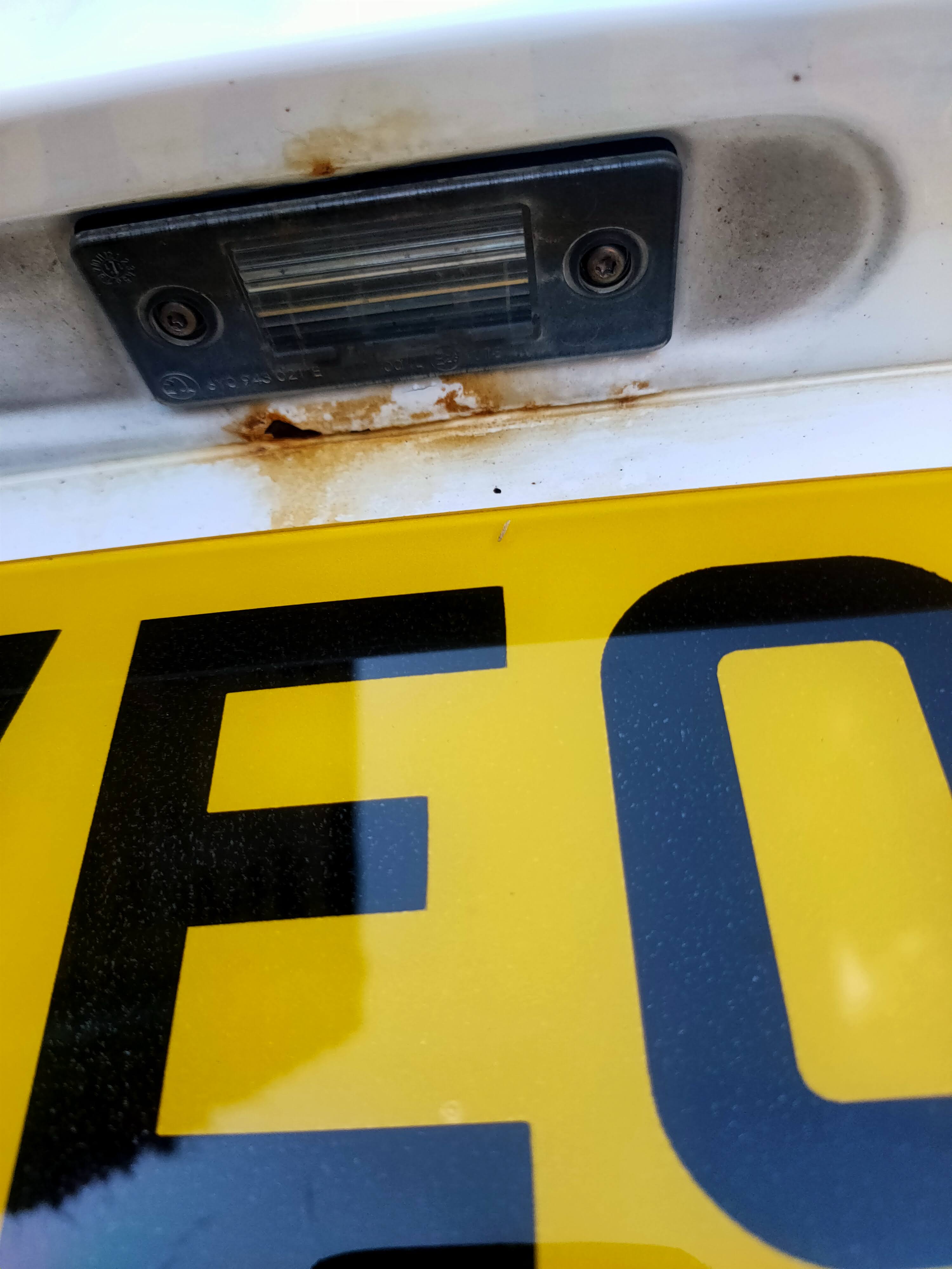 Rust around license plate light Skoda Fabia Mk II (20072014) BRISKODA