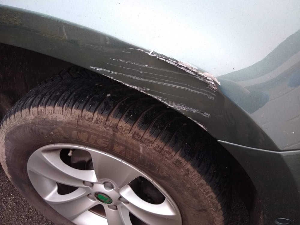 Wheel arch damage (2).jpg