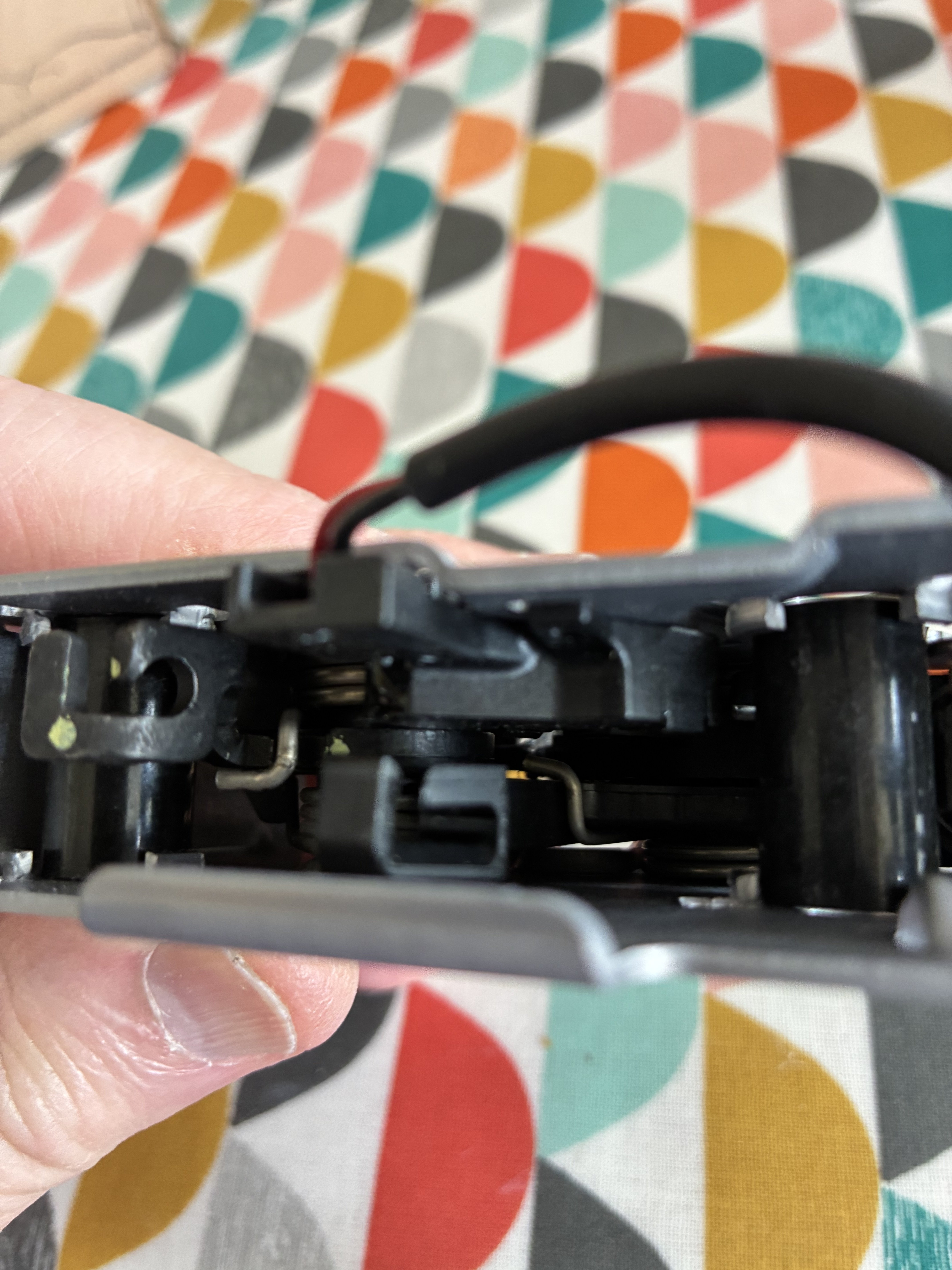 Hood latch lower portion fitting